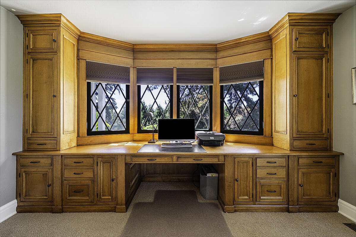 Double pocket doors in the formal living room open to the office/music room.