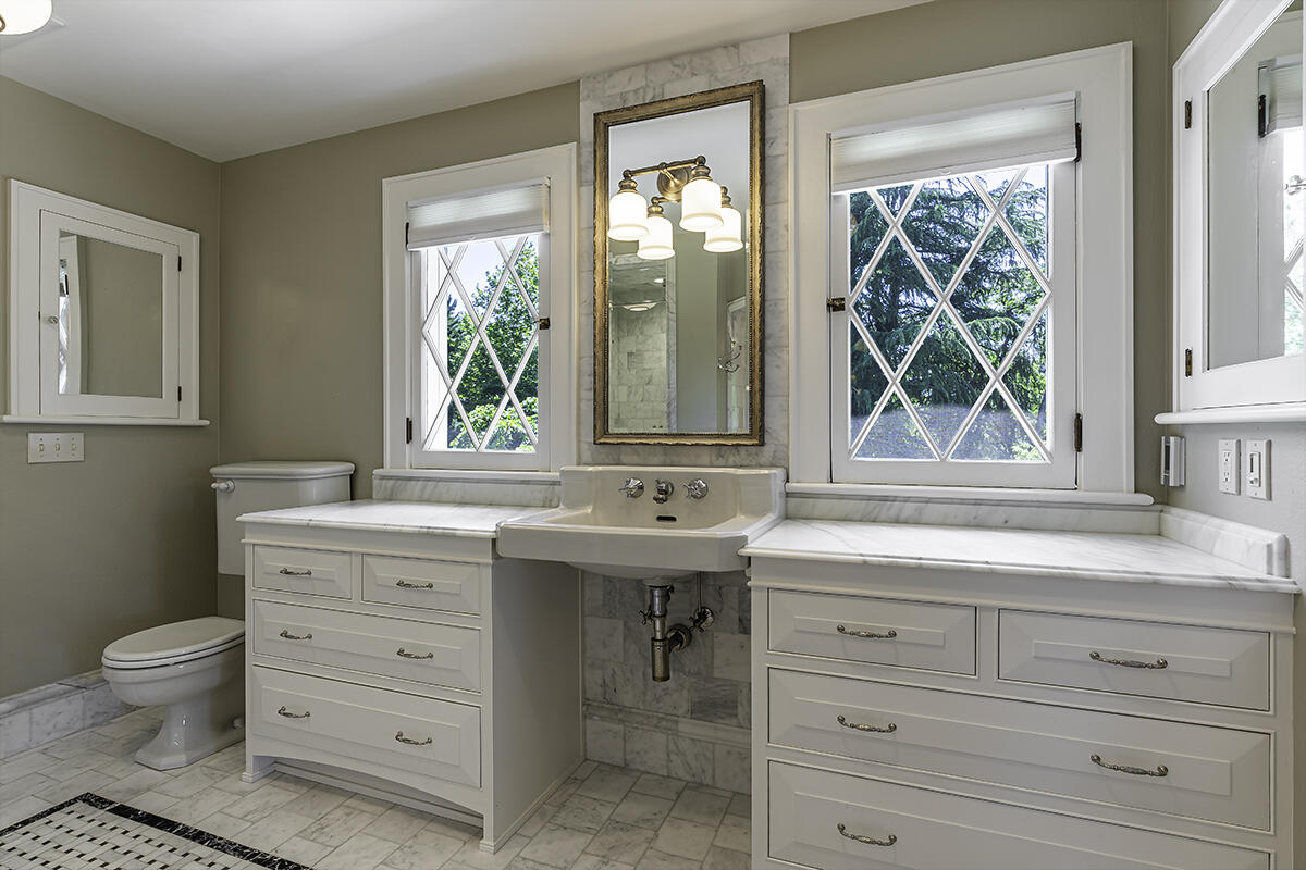 Second level hallway w/original maple floors & built-ins.